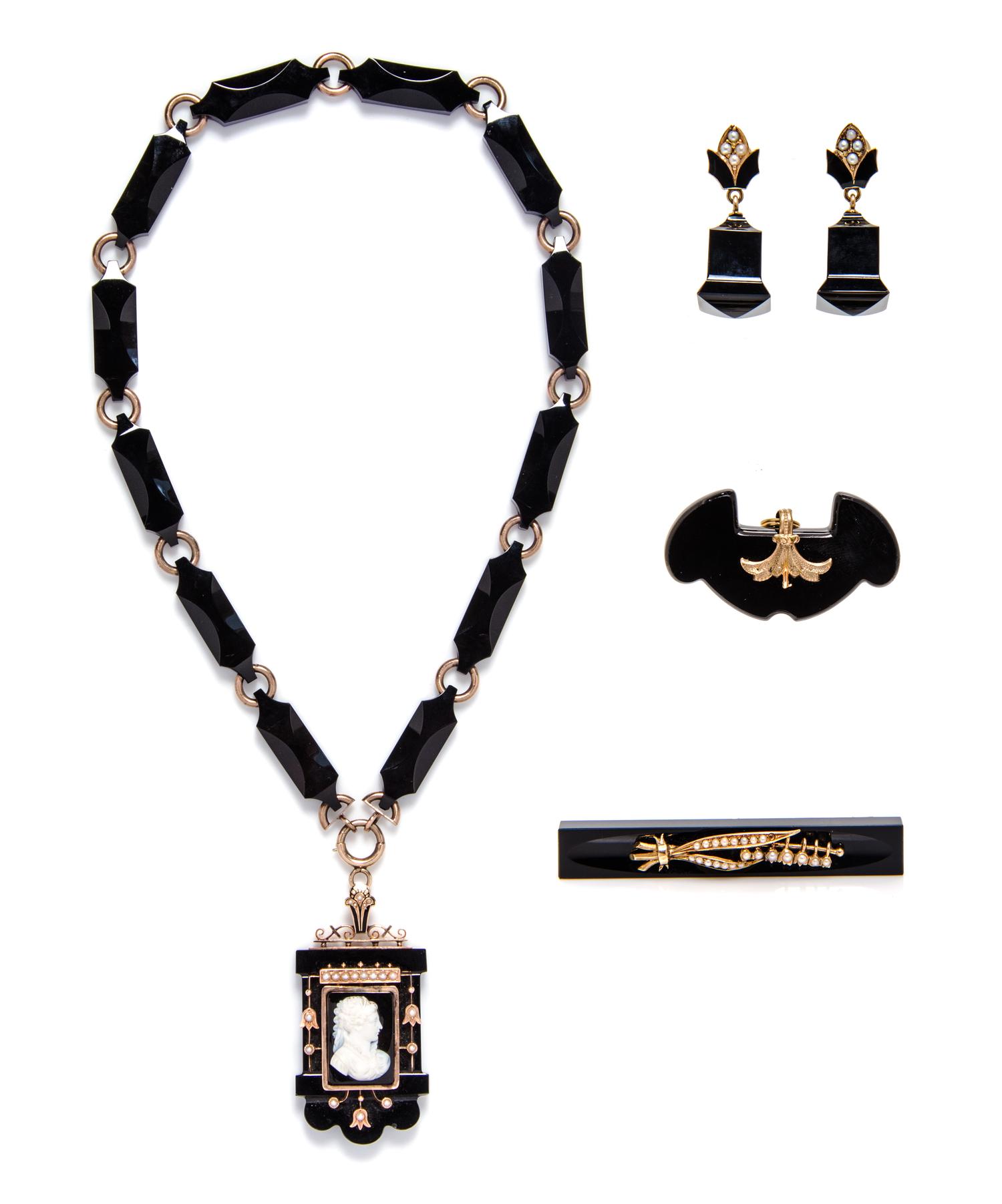 A Collection of Victorian Gold, Onyx, Seed Pearl, Enamel and Cameo Mourning Jewelry, 71.90 dwts.