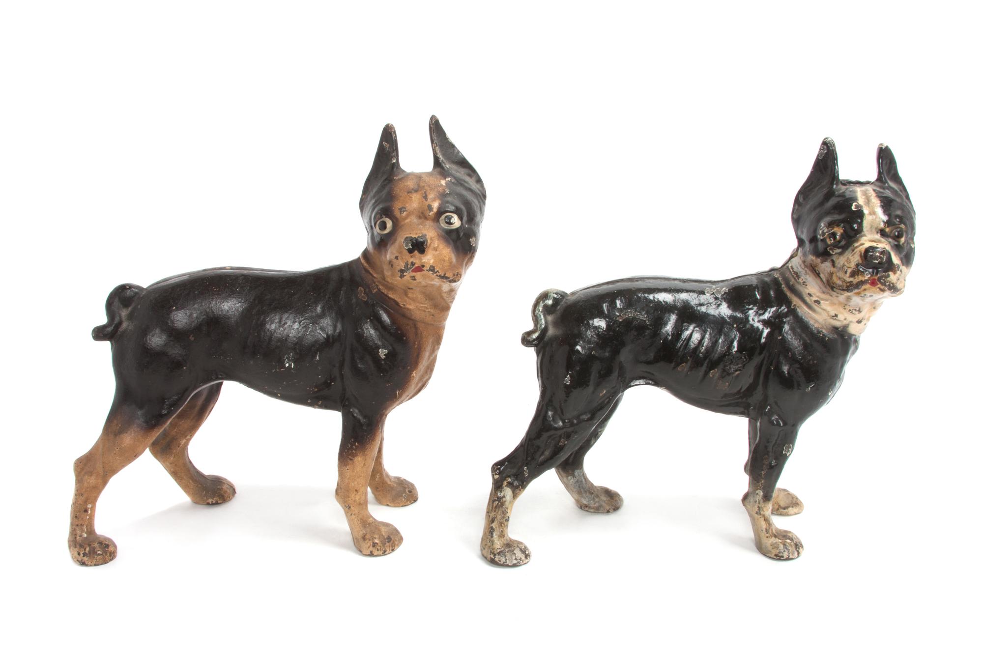 A Pair of Painted Cast Iron Door Stops Height of each 10 inches.