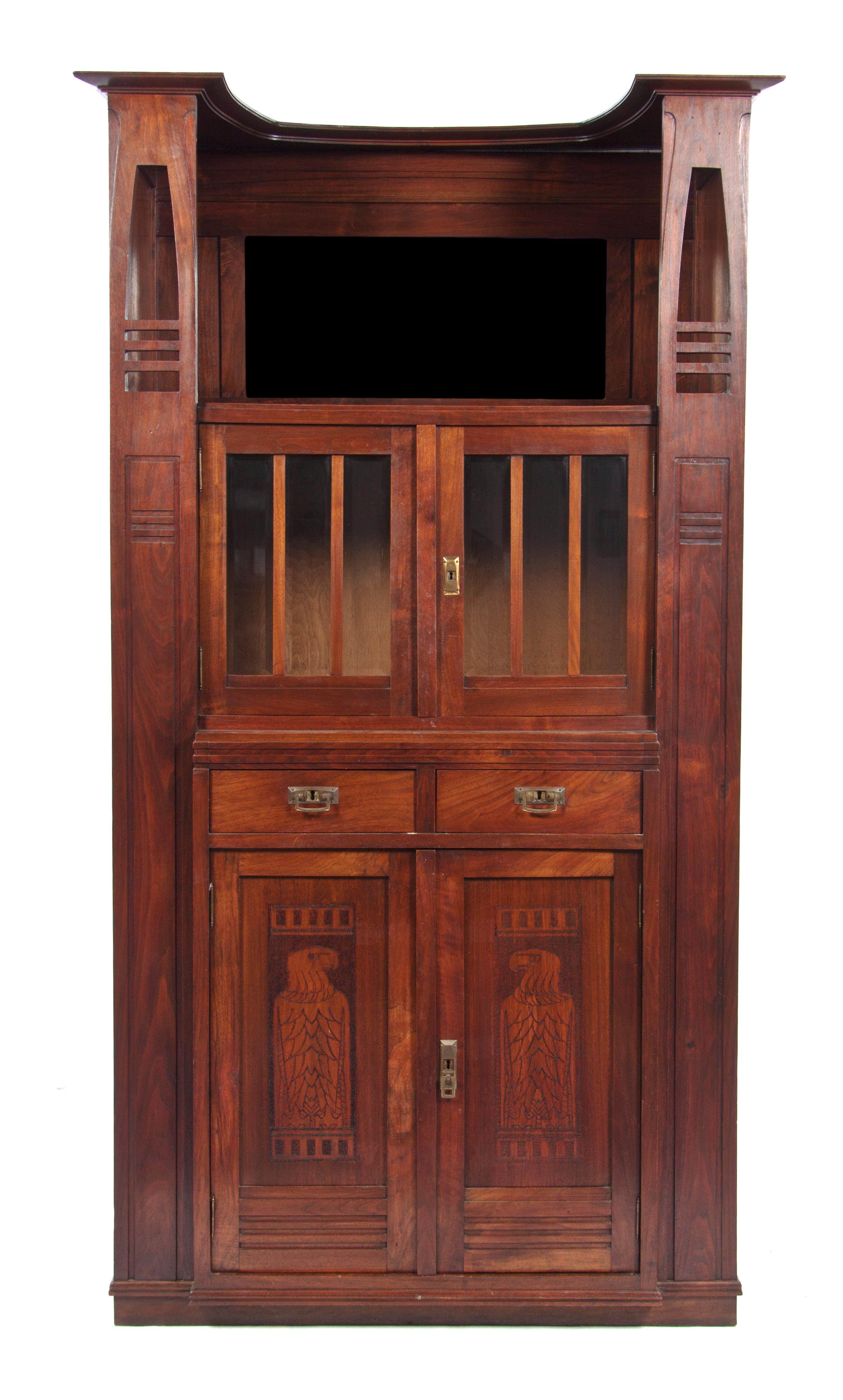 An English Arts & Crafts Walnut Cabinet, Height 77 7/8 x width 39 1/4 x depth 19 1/2 inches.