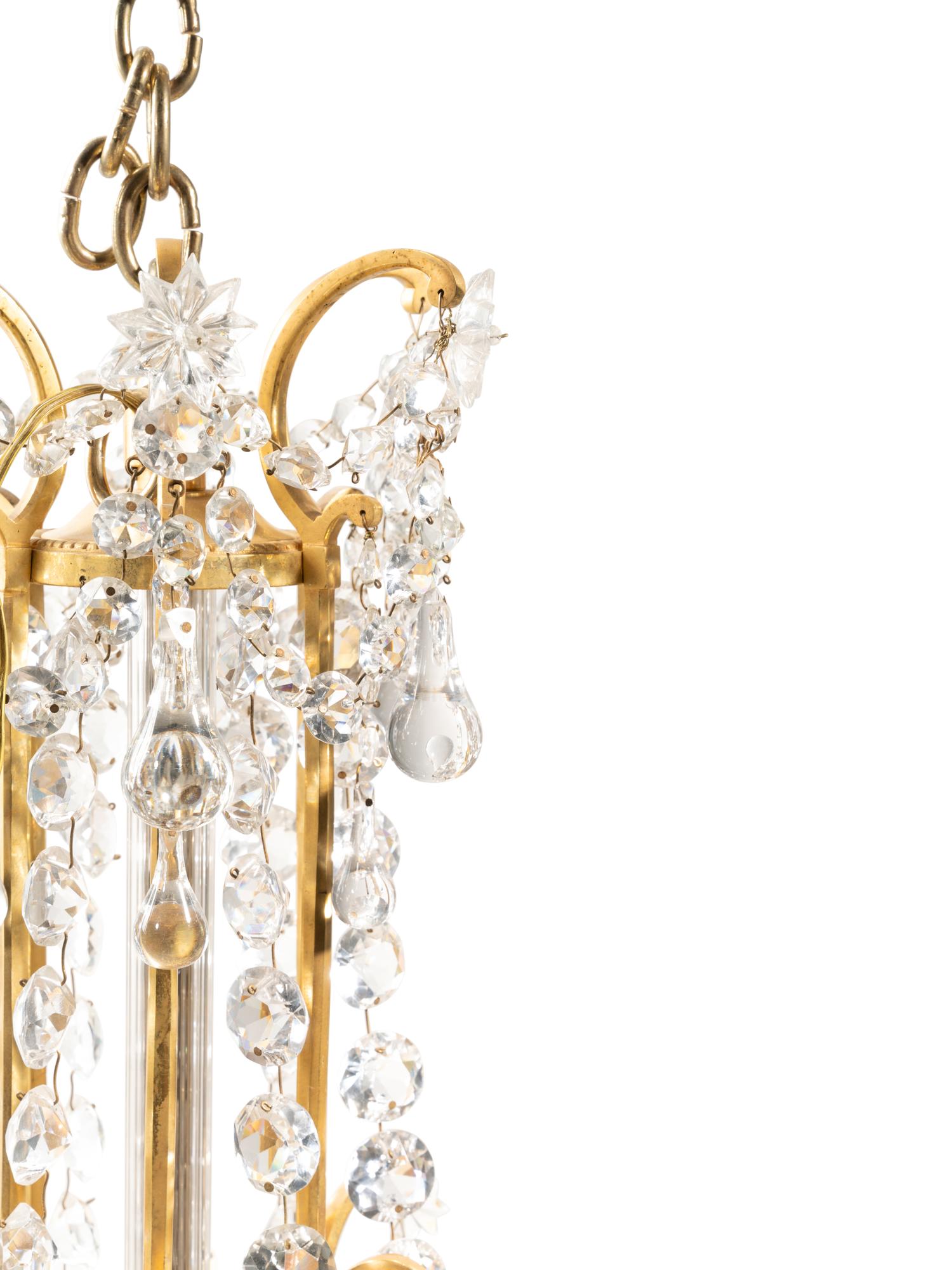 A French Gilt Bronze and Cut Glass Eighteen-Light Chandelier Attributed to Baccarat