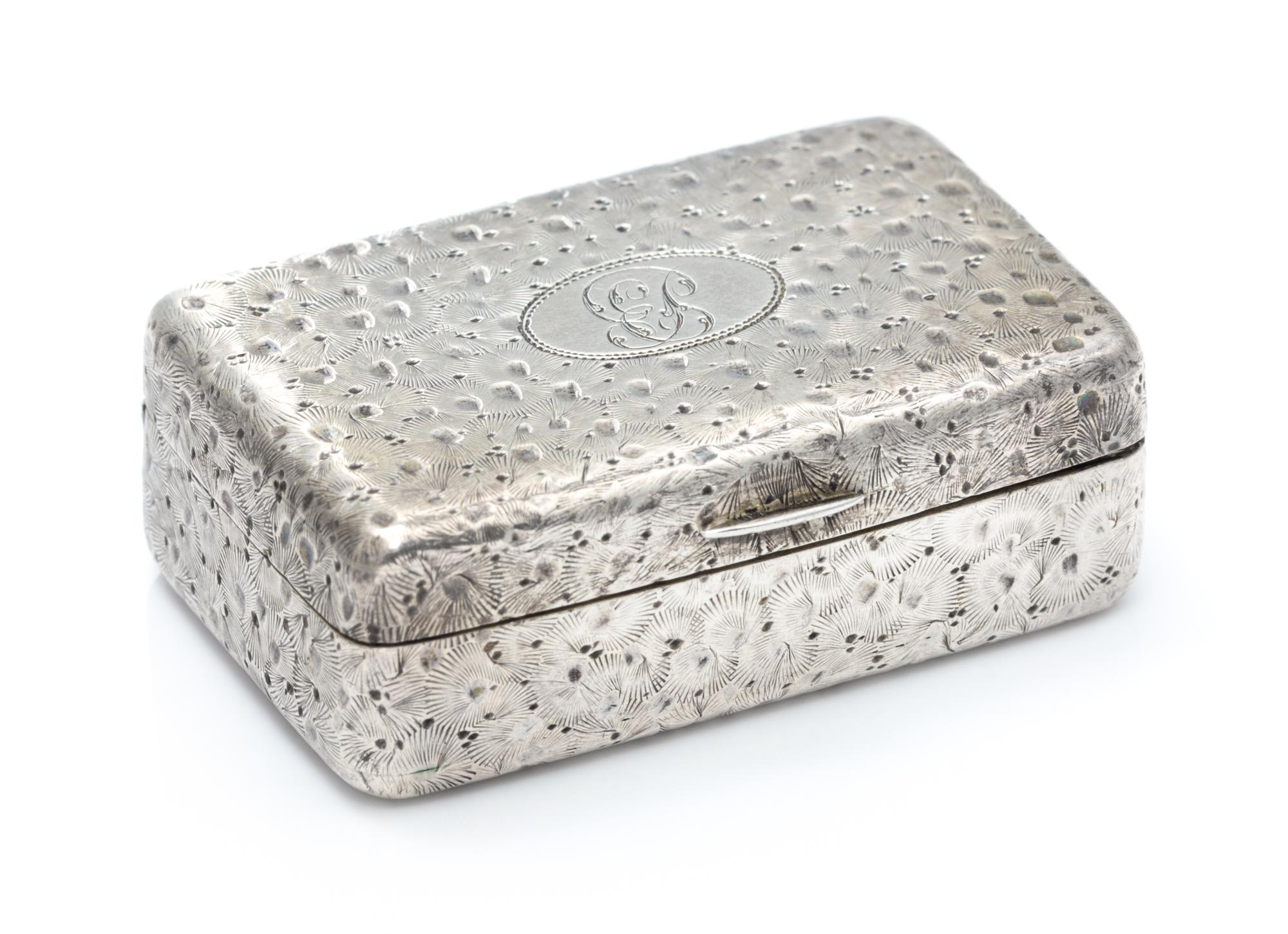 A George III Silver Vinaigrette, William Edwards, London, 1804, the case worked with floral decoration throughout, the lid centered by