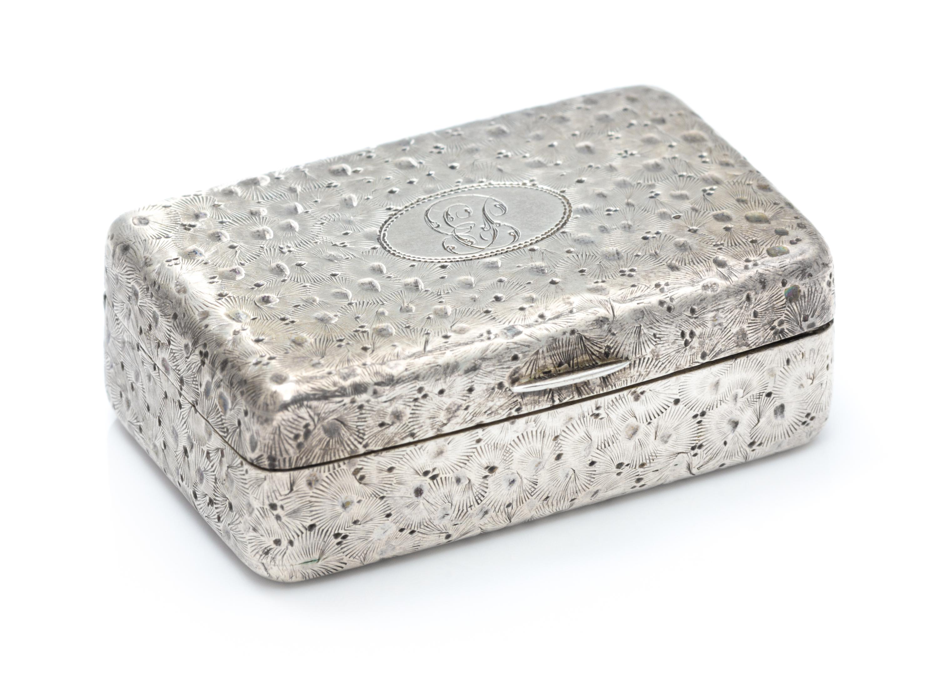 A George III Silver Vinaigrette, William Edwards, London, 1804, the case worked with floral decoration throughout, the lid centered by