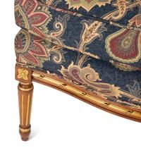 A Pair of Louis XVI Style Parcel Gilt Fruitwood Bergères