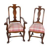 A Set of Six Continental Scroll-Carved Walnut Dining Chairs