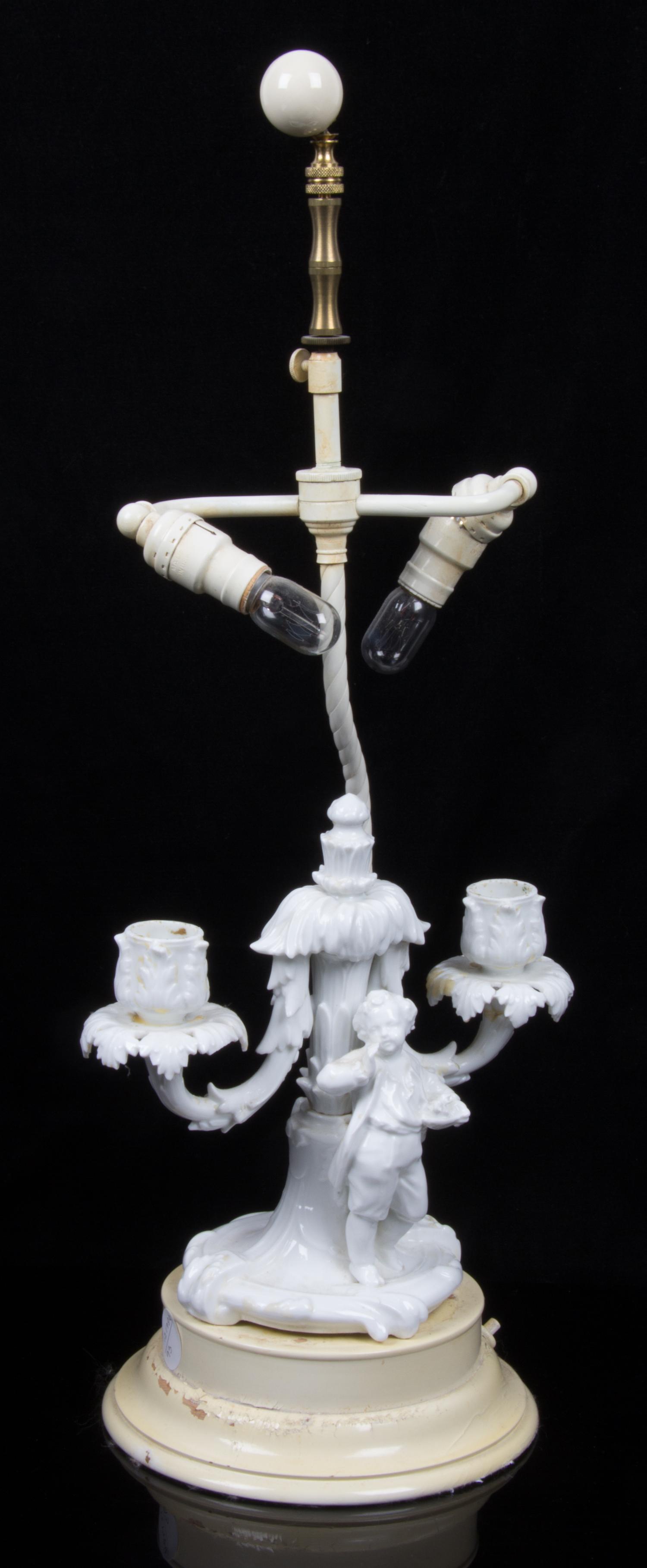 A Continental Blanc de Chine Figural Two Light Candelabra Overall height of taller 22 1/2 inches. — 19TH/20TH CENTURY