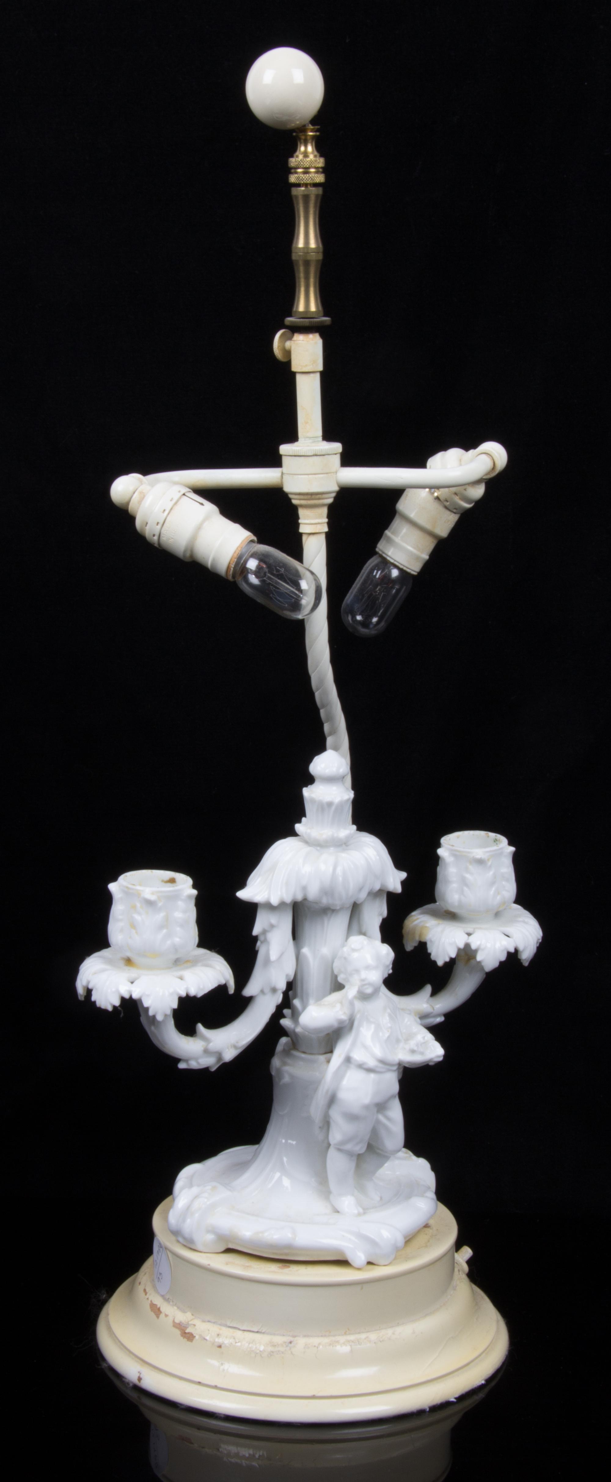 A Continental Blanc de Chine Figural Two Light Candelabra Overall height of taller 22 1/2 inches. — 19TH/20TH CENTURY
