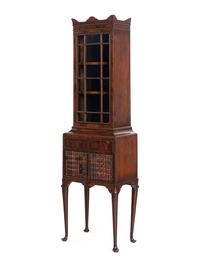 A Regency Mahogany and Faux-Book Decorated Vitrine Cabinet on Stand