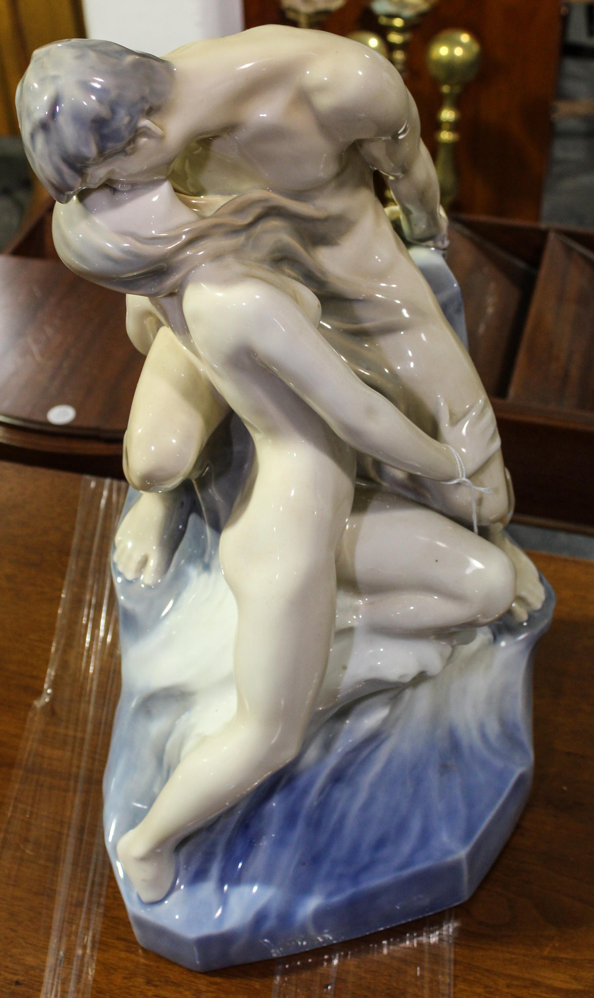 A Royal Copenhagen Figural Group. Height 18 1/2 inches.