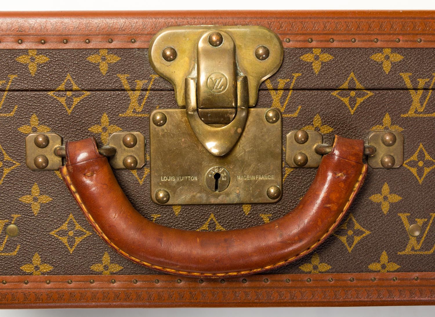 A Louis Vuitton Monogram Canvas Bisten Suitcase, 14"H x 19"W x 6.5"D; Handle drop: 2".