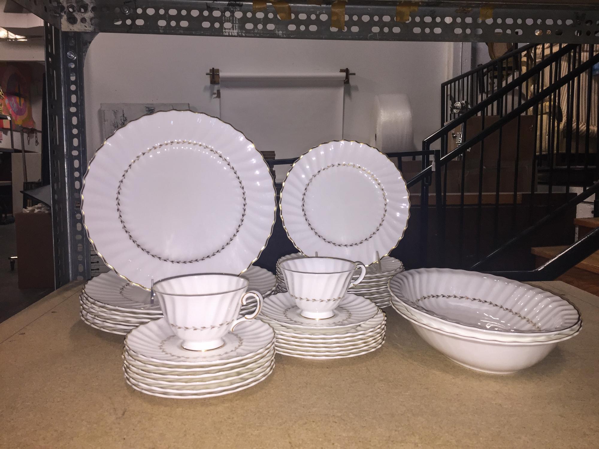 A Royal Doulton Partial Dinnerware Service Diameter of dinner plate 10 1/2 inches.