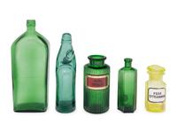 A Group of Green Glass Apothecary Bottles