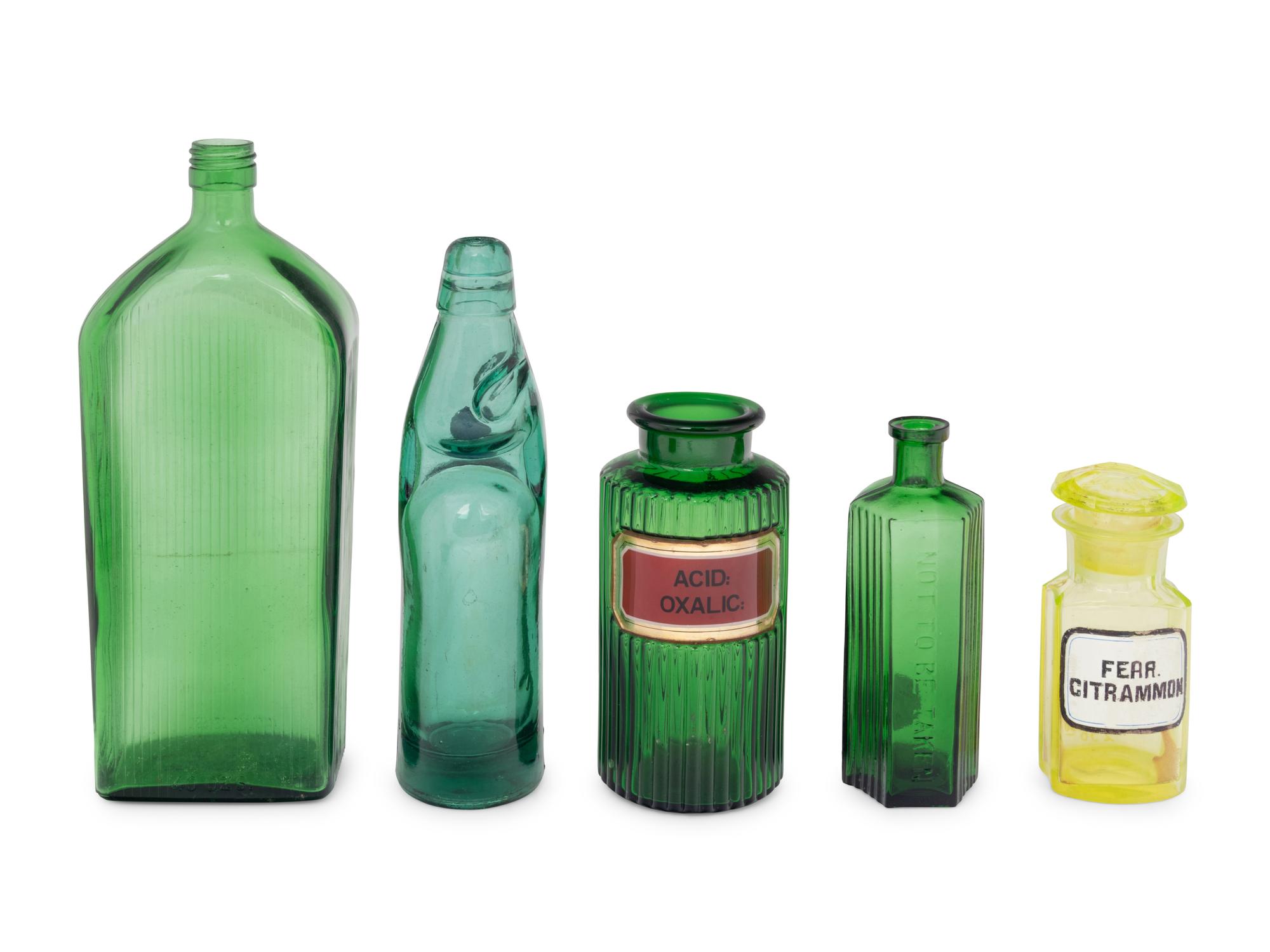 A Group of Green Glass Apothecary Bottles