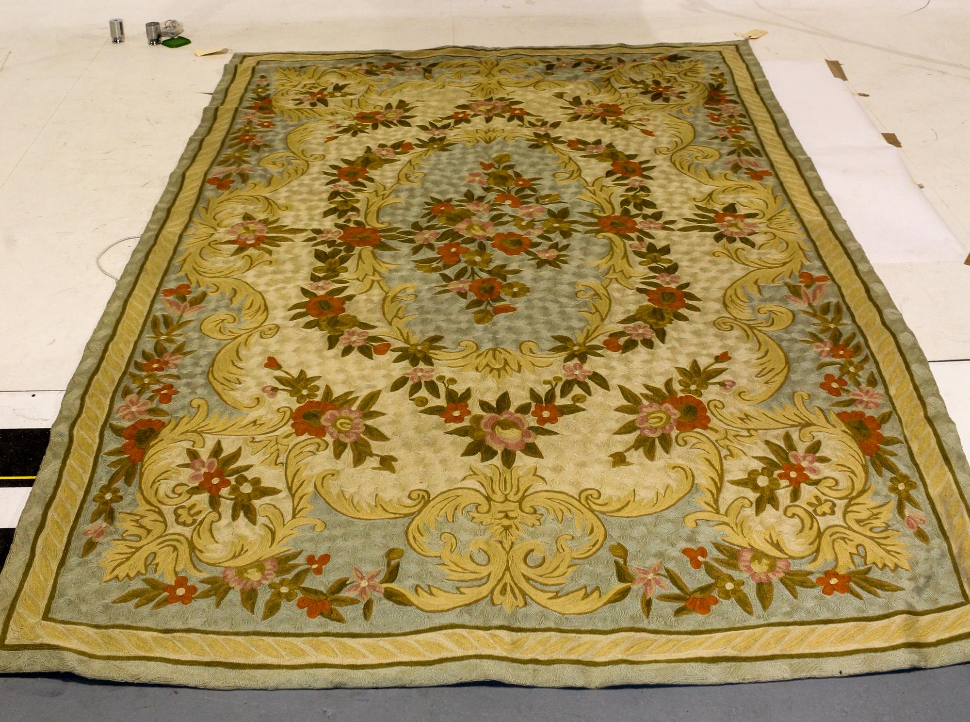 An Aubusson Style Hooked Tapestry 8 feet 9 inches x 5 feet 8 inches.