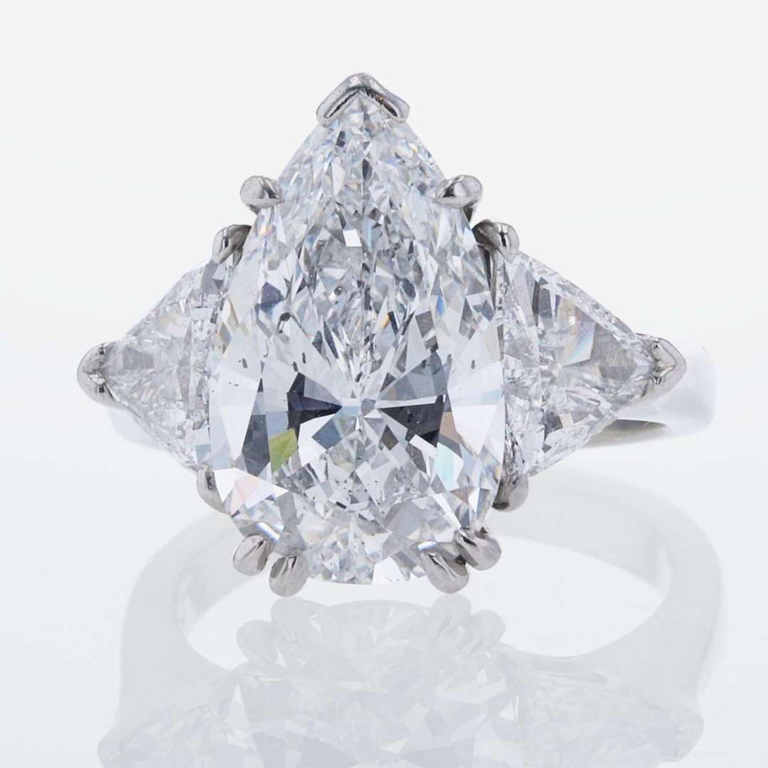 Three-Stone Diamond and Platinum Ring 5.97 Carat Pear-Shape Diamond, GIA Certified