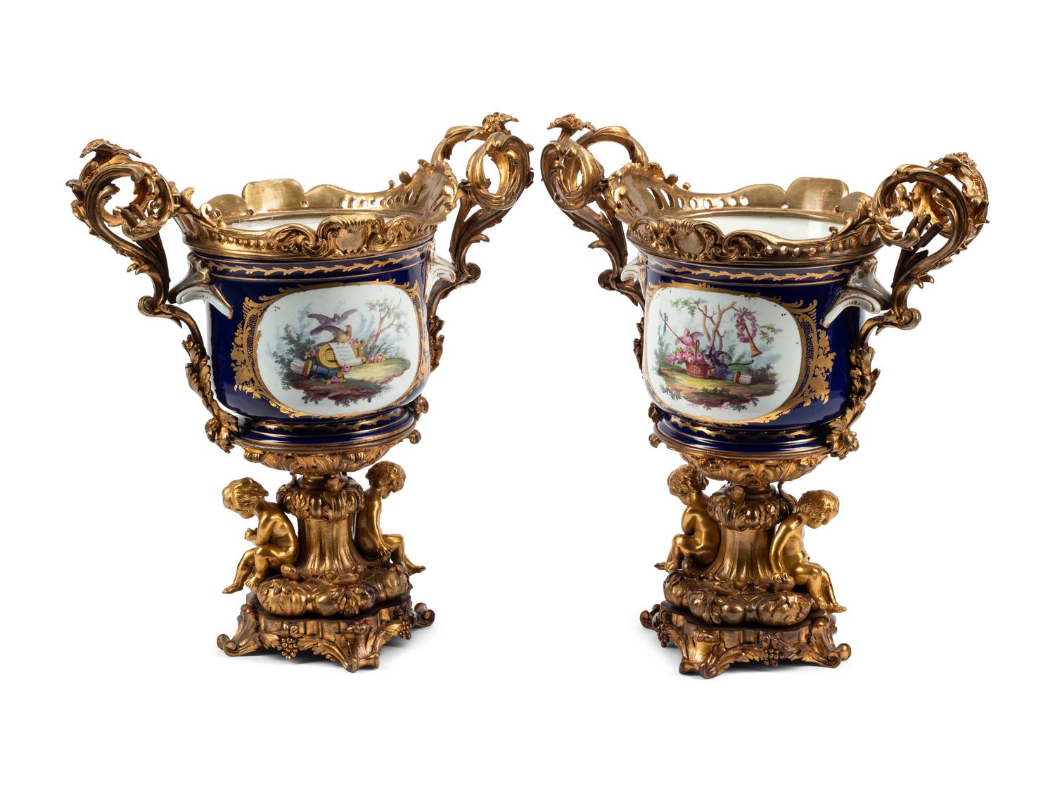 A Pair of Gilt Bronze Mounted Sèvres Style Porcelain Cache Pots