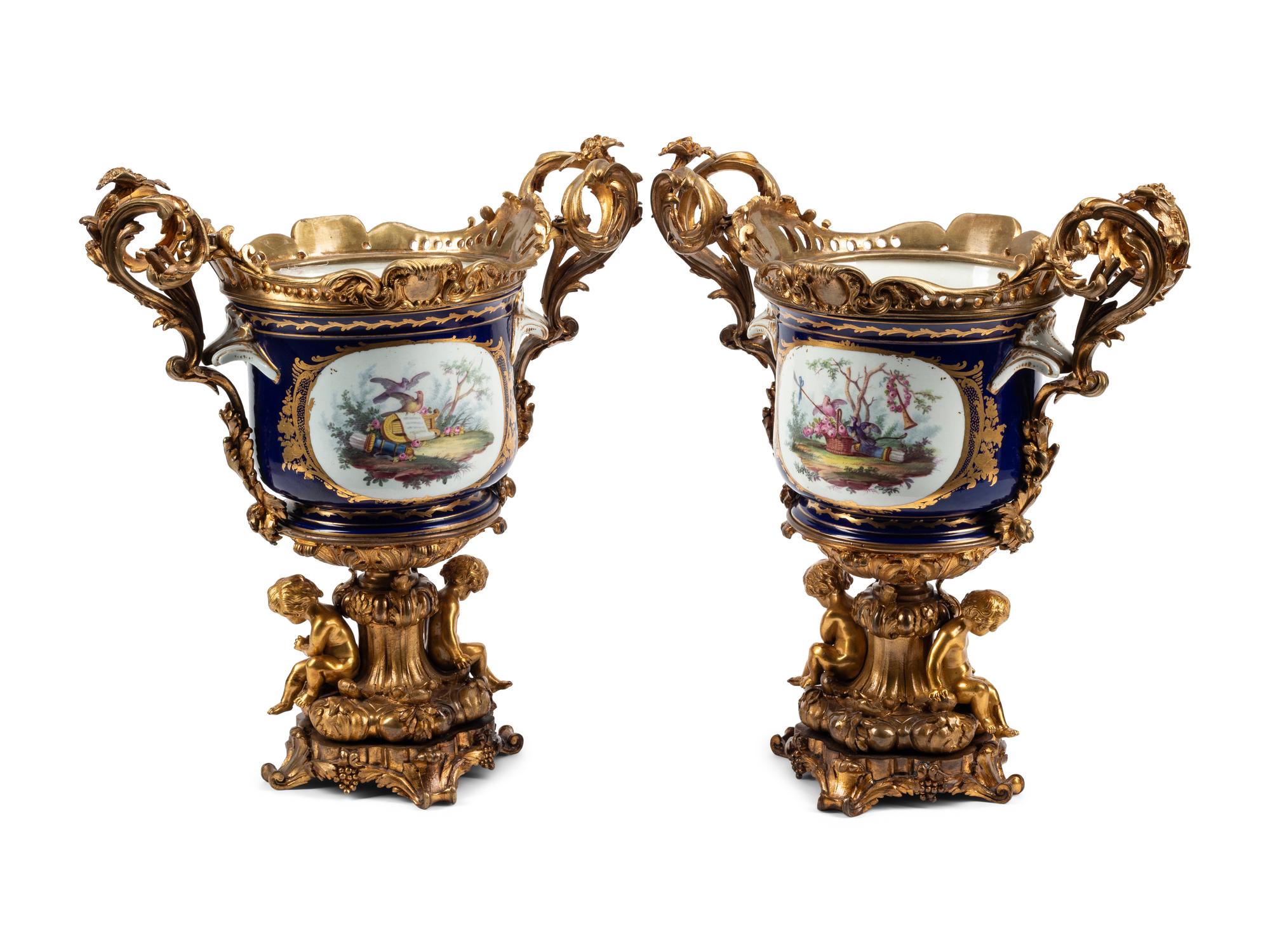 A Pair of Gilt Bronze Mounted Sèvres Style Porcelain Cache Pots