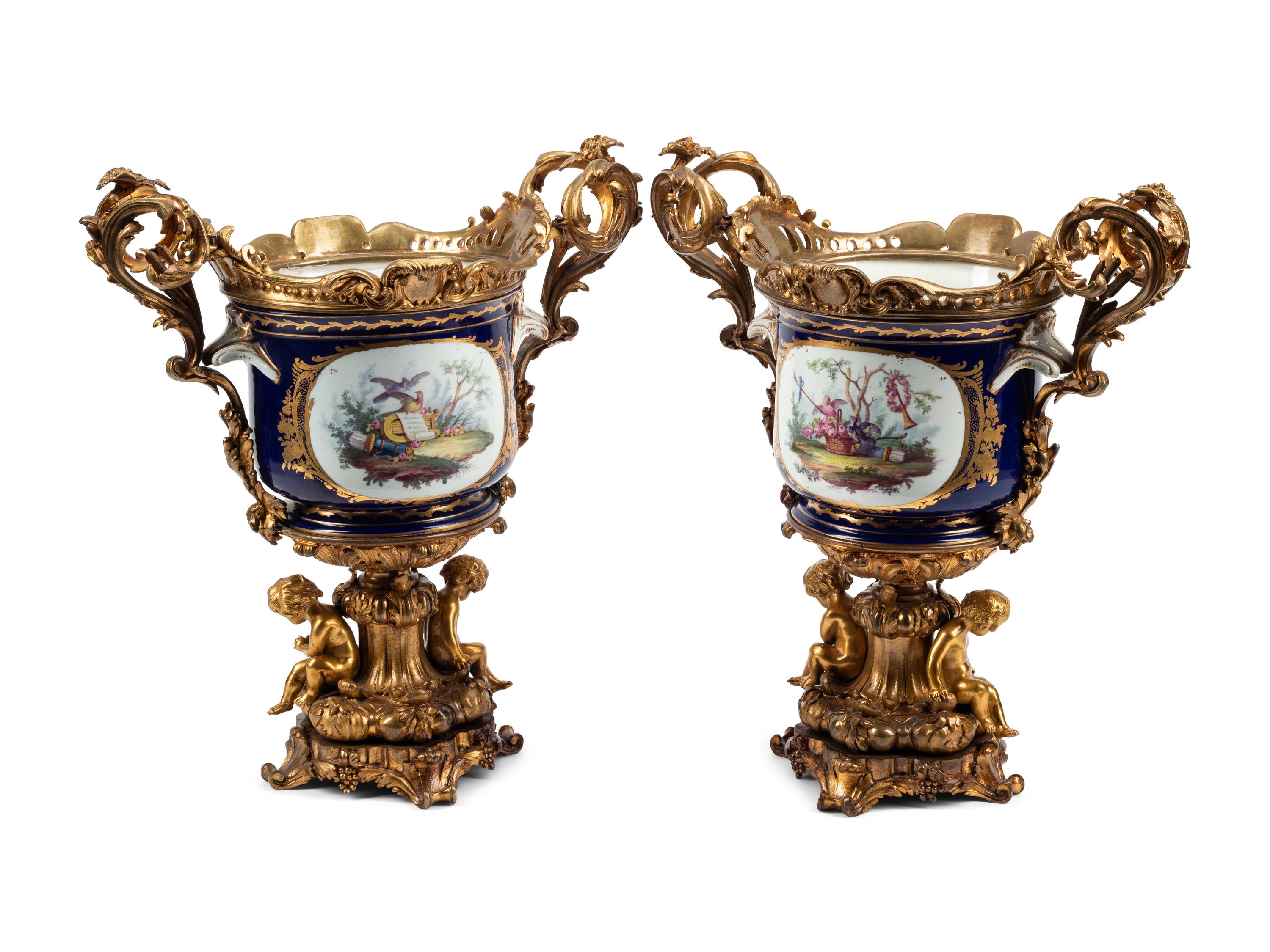 A Pair of Gilt Bronze Mounted Sèvres Style Porcelain Cache Pots