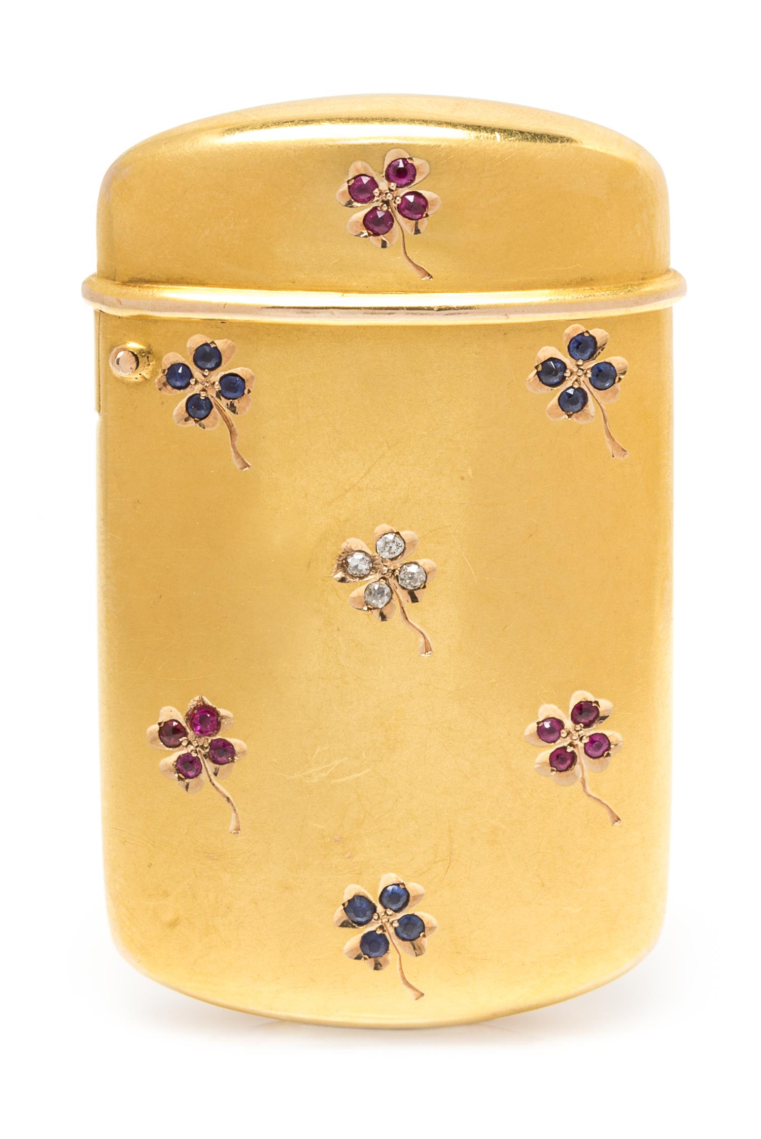 An American 14 Karat Gold and Jeweled Vesta Case, , the case worked with clover motifs decorated having diamond, ruby and sapphire leav