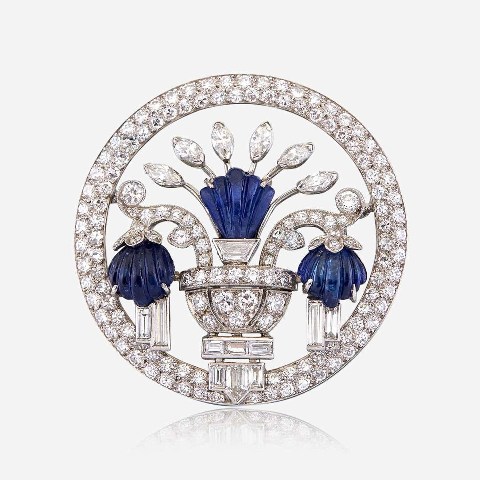 A diamond, carved sapphire, and platinum brooch, J. E. Caldwell & Co.