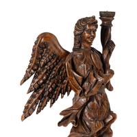 A Pair of Monumental Carved Walnut Figural Torchères
