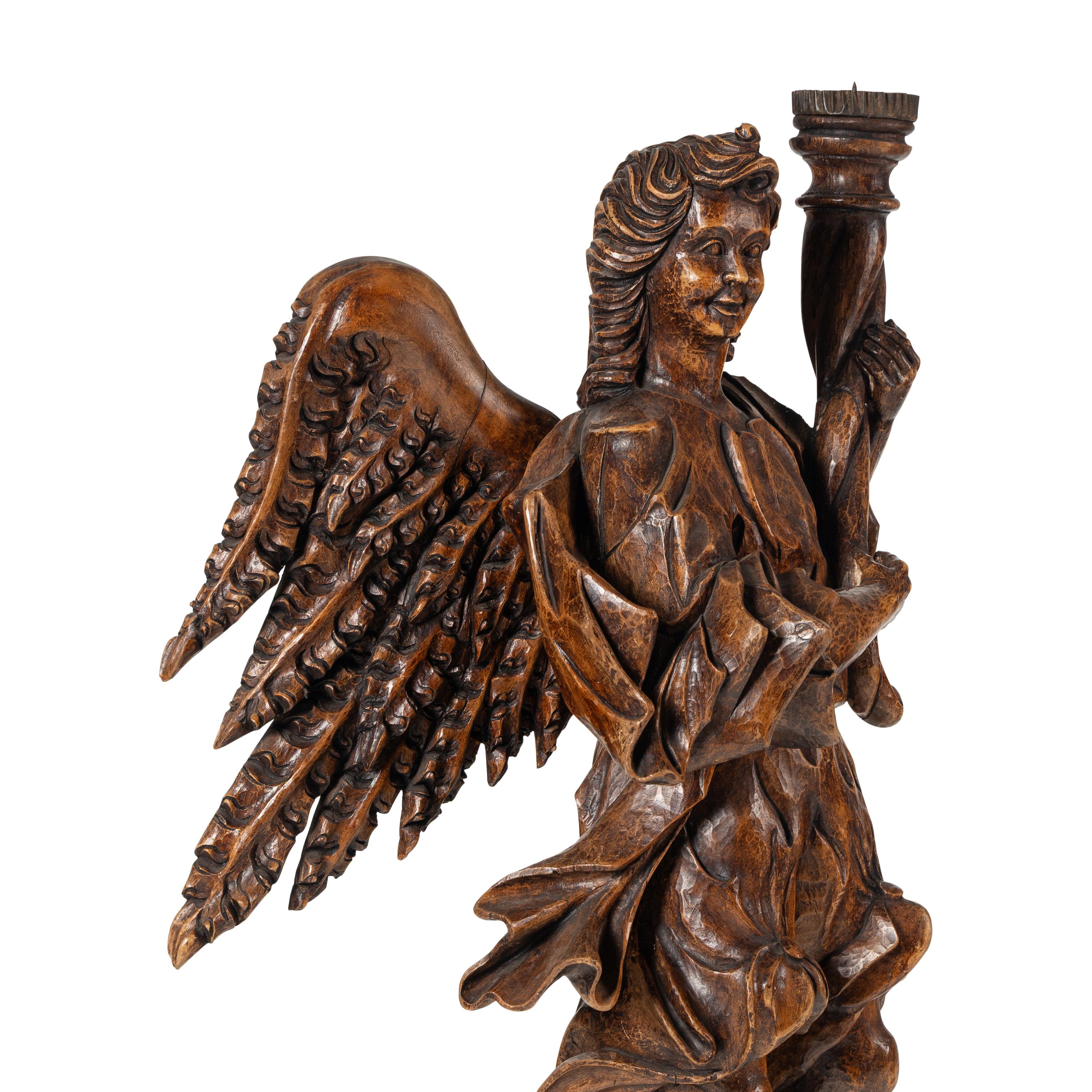 A Pair of Monumental Carved Walnut Figural Torchères