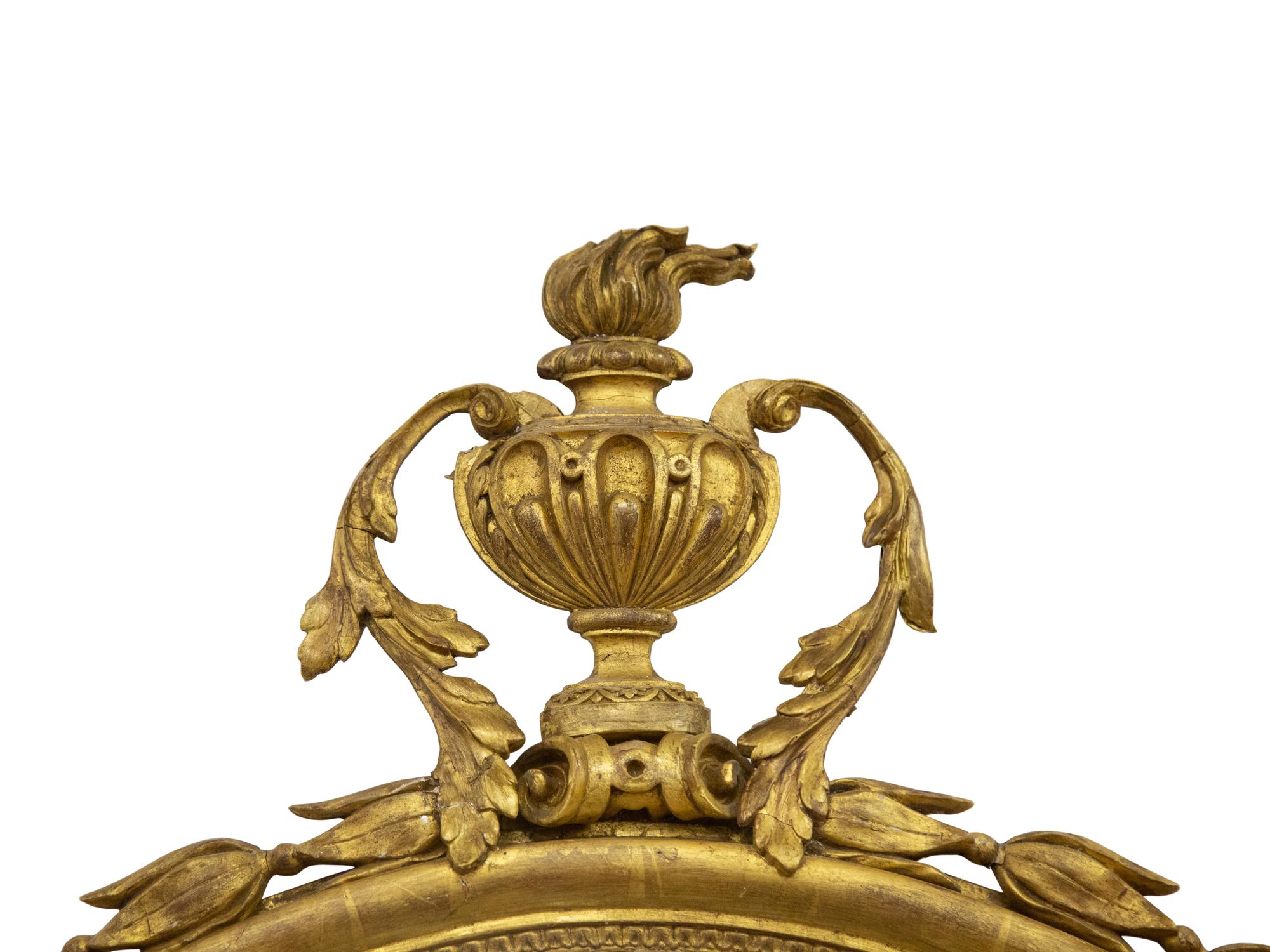 A Pair of George II Style Oval Giltwood Mirrors