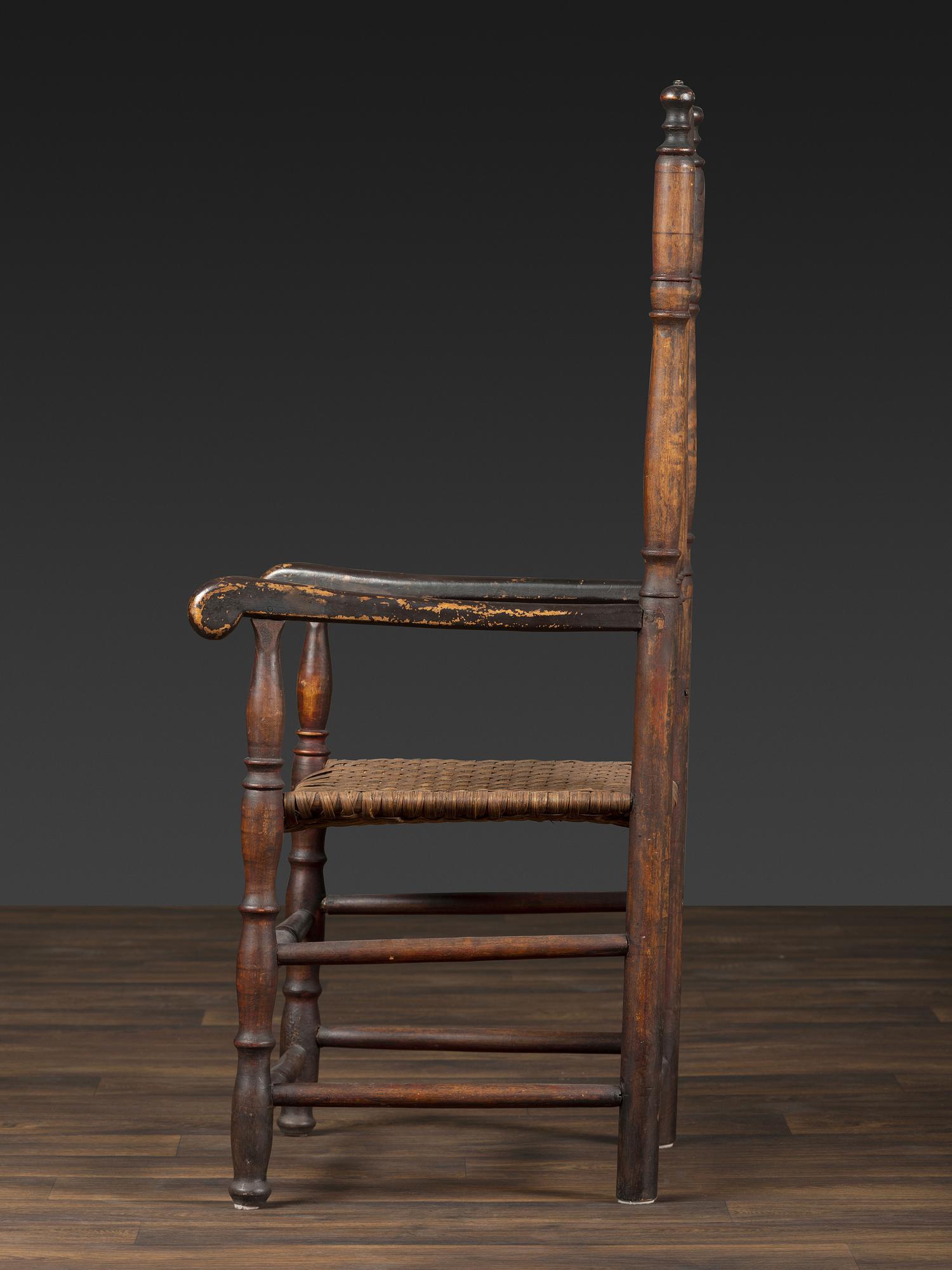 A William and Mary Style Parcel Gilt and Red Painted, Fan-Carved Bannister Back Woven Splint Seat Armchair