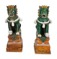 A Pair of Chinese Sançai Glazed Ceramic Guardian Lions on Pedestal Bases