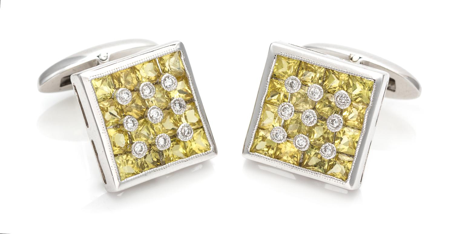 A Pair of 14 Karat White Gold, Yellow Sapphire and Diamond Cufflinks, 4.70 dwts.