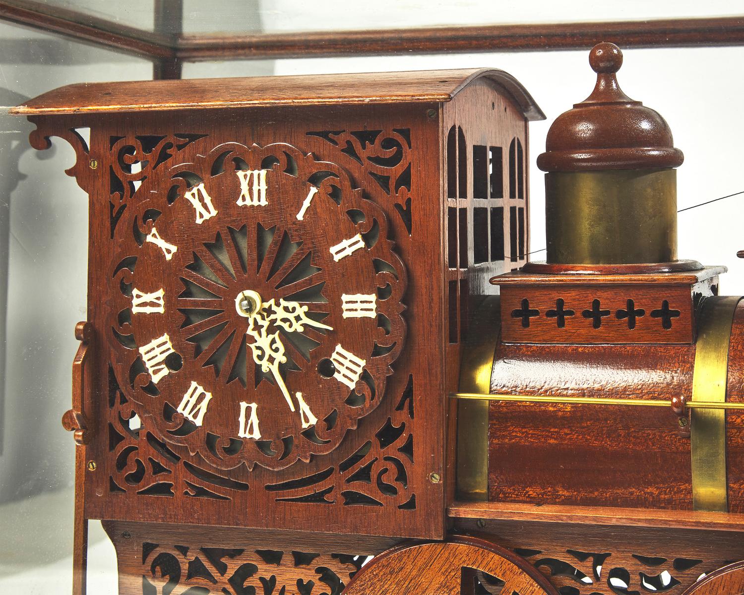A brass-fitted mahogany 1886 steam locomotive / train fitted with clock, made by R. Davidson, April 10, 1910, works by Waterbury Clock Co.