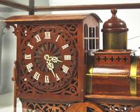 A brass-fitted mahogany 1886 steam locomotive / train fitted with clock, made by R. Davidson, April 10, 1910, works by Waterbury Clock Co.