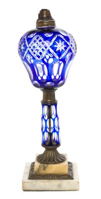 An American Cut Overlay Fluid Lamp, Boston and Sandwich Glass Co., Height 18 1/2 inches.
