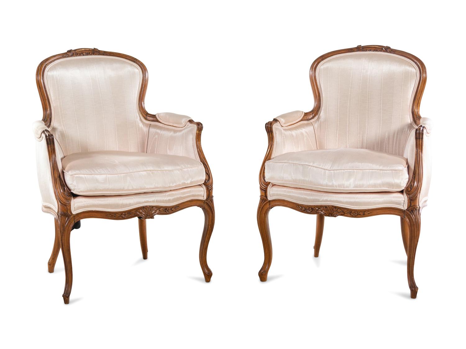 A Pair of Louis XV Style Walnut Bergères