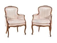A Pair of Louis XV Style Walnut Bergères