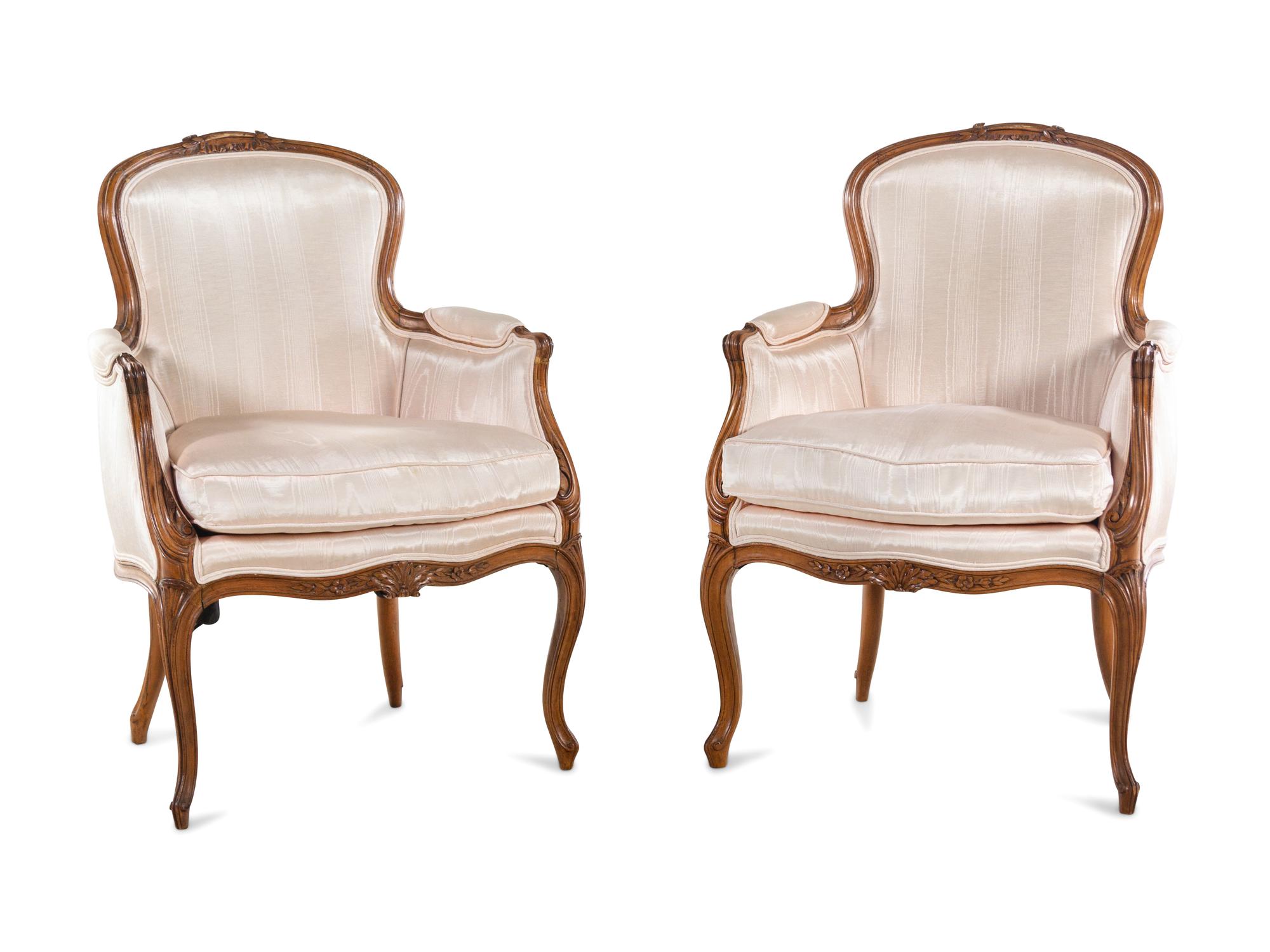 A Pair of Louis XV Style Walnut Bergères