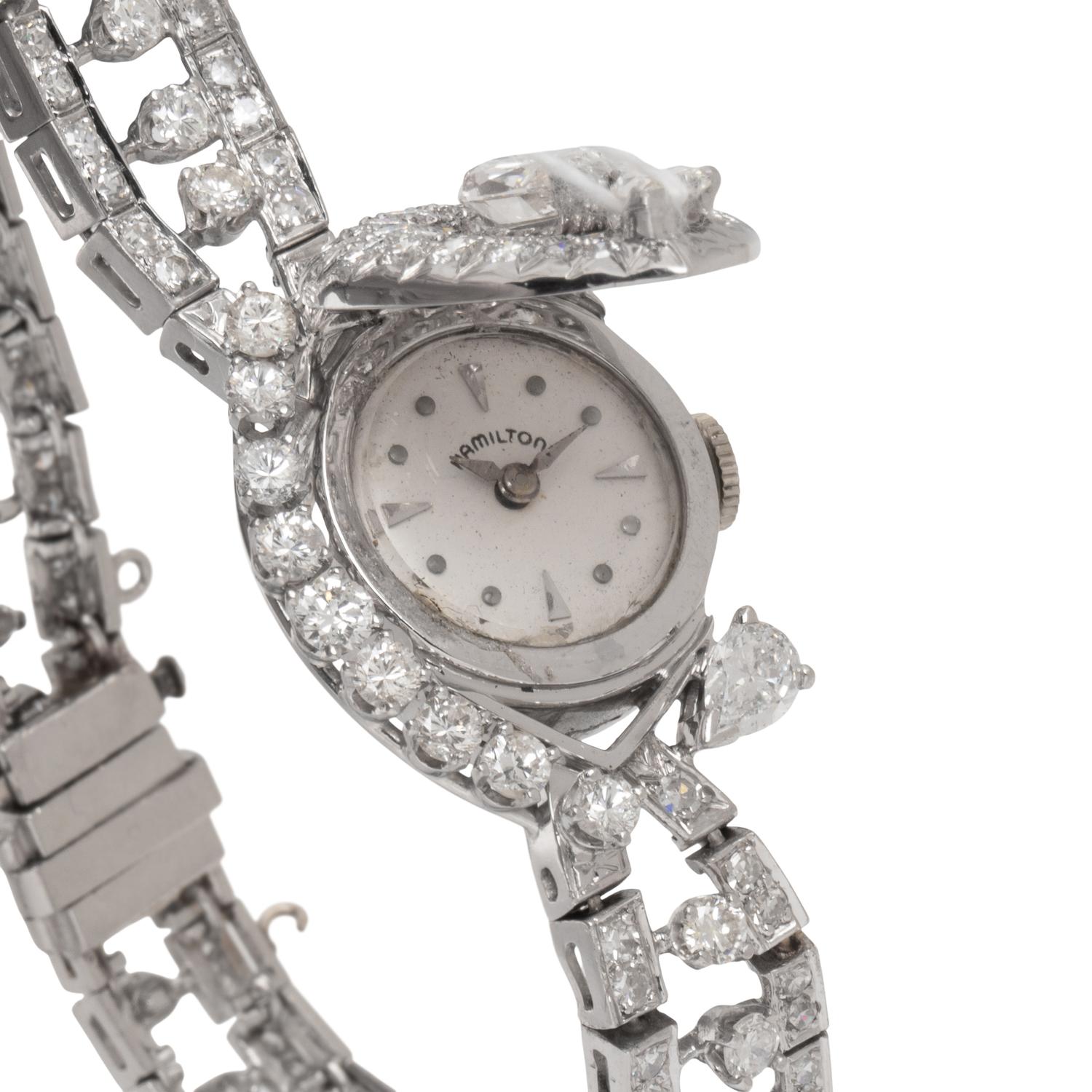HAMILTON, PLATINUM AND DIAMOND SURPRISE WATCH