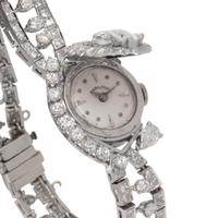 HAMILTON, PLATINUM AND DIAMOND SURPRISE WATCH