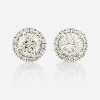 A pair of diamond and white gold earrings