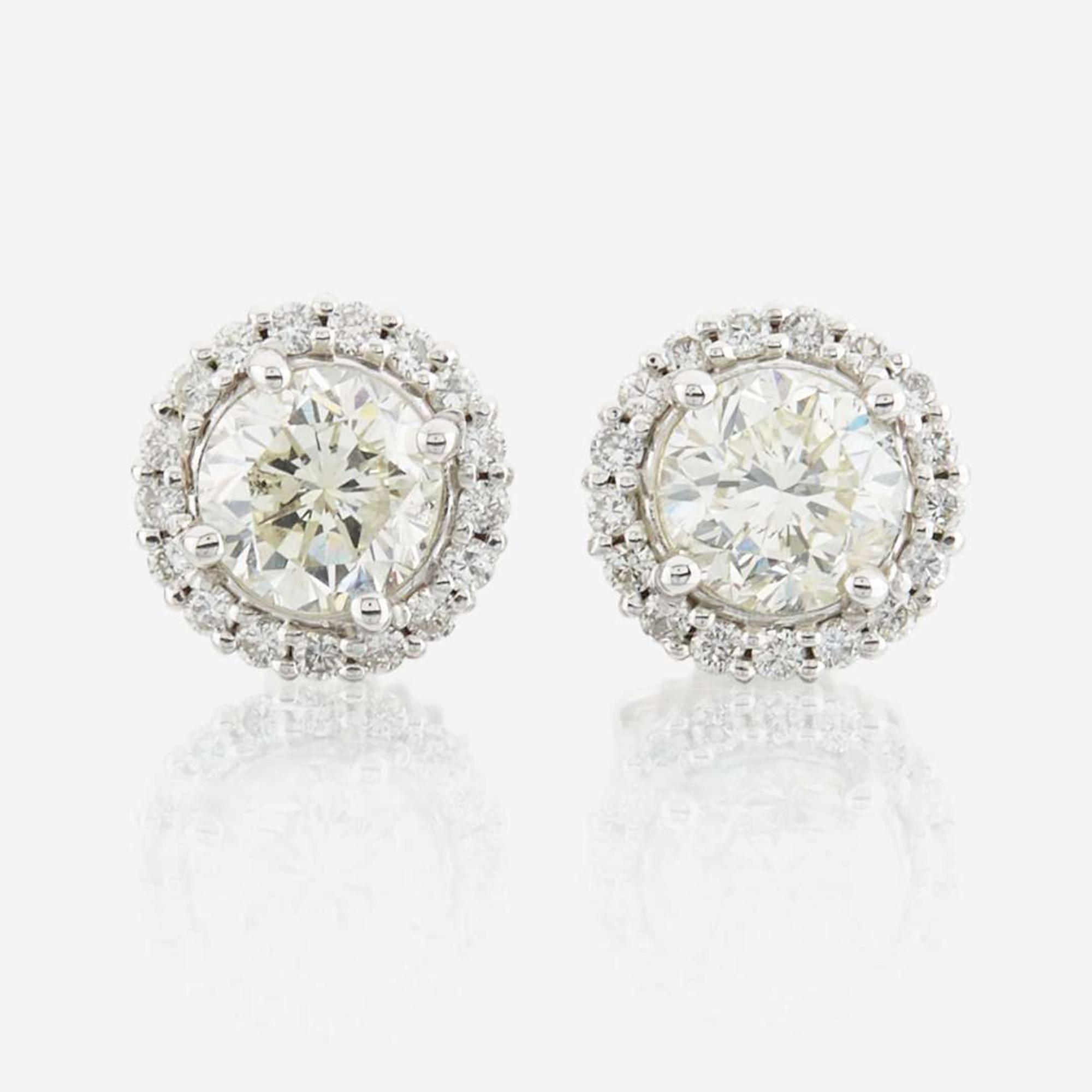 A pair of diamond and white gold earrings