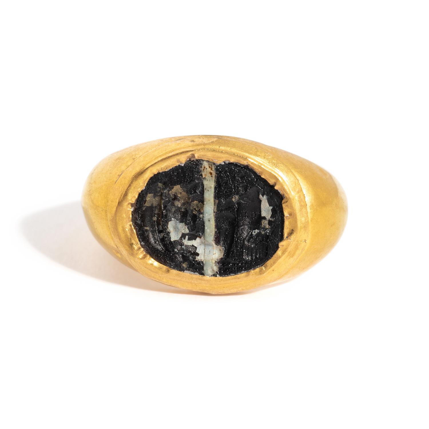 A Roman Gold and Banded Glass Finger Ring with a Kneeling Hero