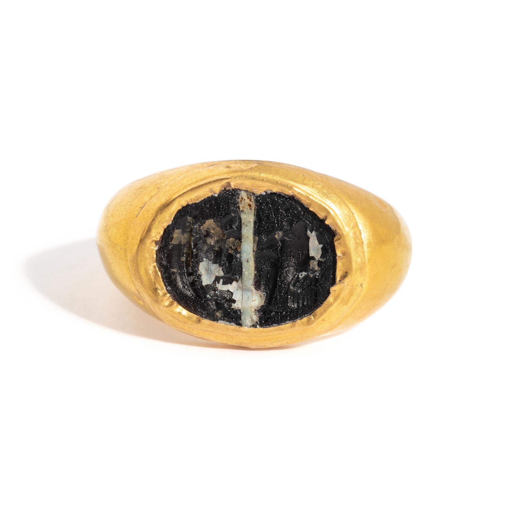 A Roman Gold and Banded Glass Finger Ring with a Kneeling Hero