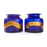 Two Painted Blue Glass Apothecary Jars for Cocaine and Opium