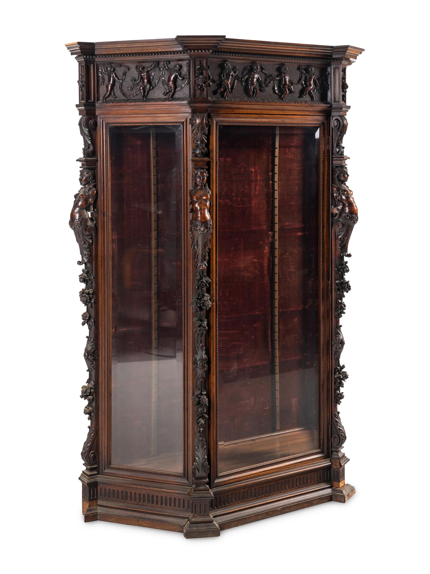 An Italian Renaissance Revival Carved Walnut Cabinet