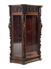 An Italian Renaissance Revival Carved Walnut Cabinet