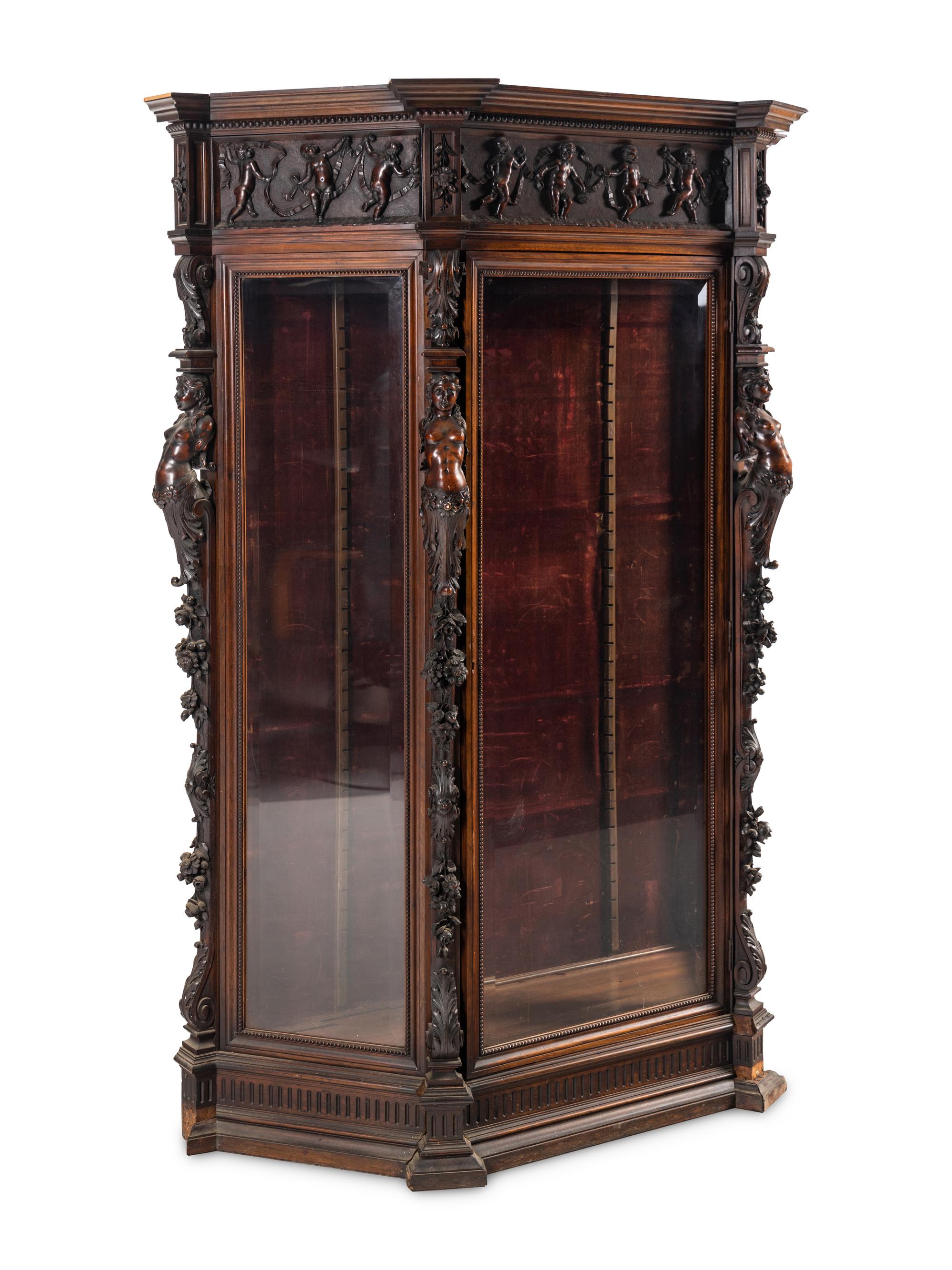 An Italian Renaissance Revival Carved Walnut Cabinet