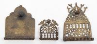A Group of Seven Brass Menorahs Height of tallest 18 1/4 inches.