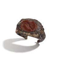 A Roman Iron and Red Jasper Finger Ring with a Gryllos (Composite Figure)