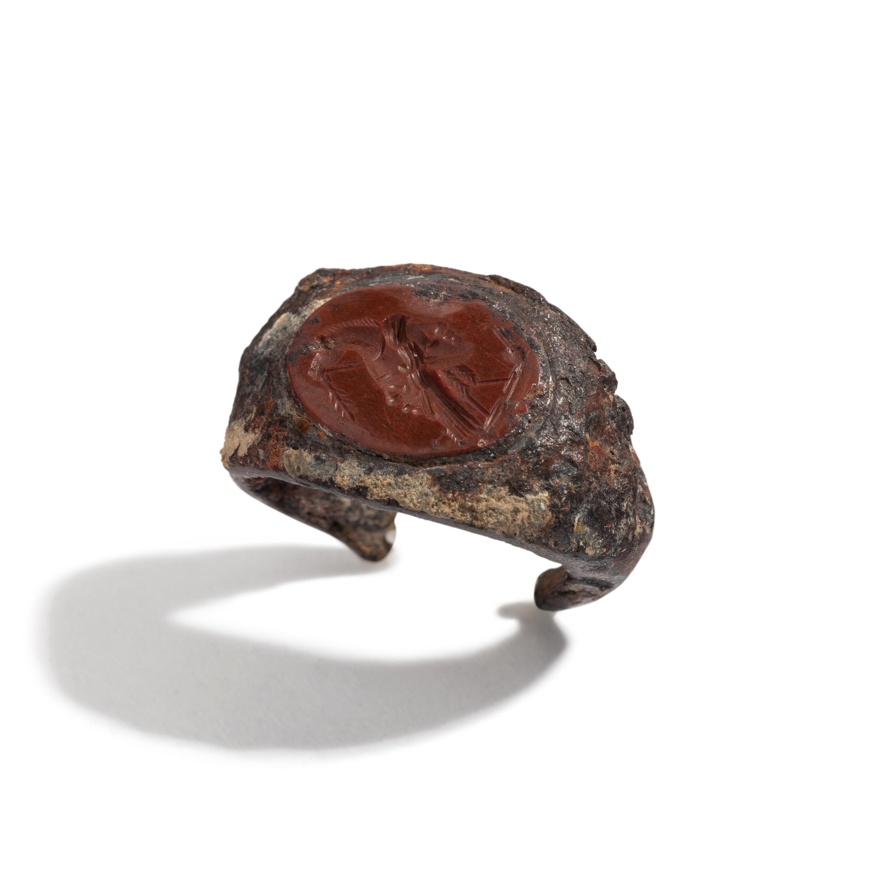 A Roman Iron and Red Jasper Finger Ring with a Gryllos (Composite Figure)