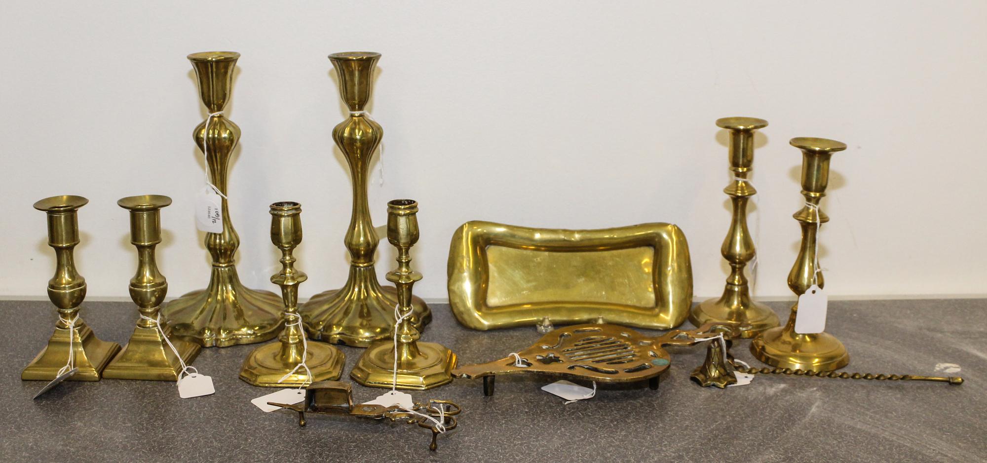 A Collection of Four Pairs of Brass Candlesticks Height of tallest pair 10 1/4 inches. — 19TH CENTURY