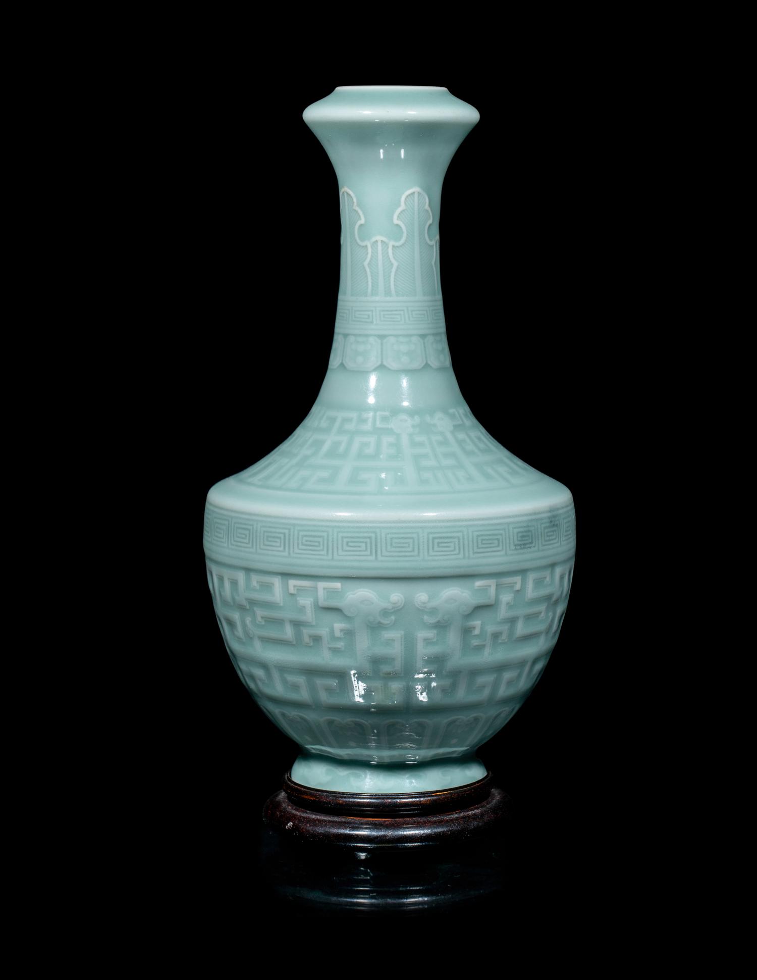 A Chinese Carved Celadon Glazed Porcelain Vase